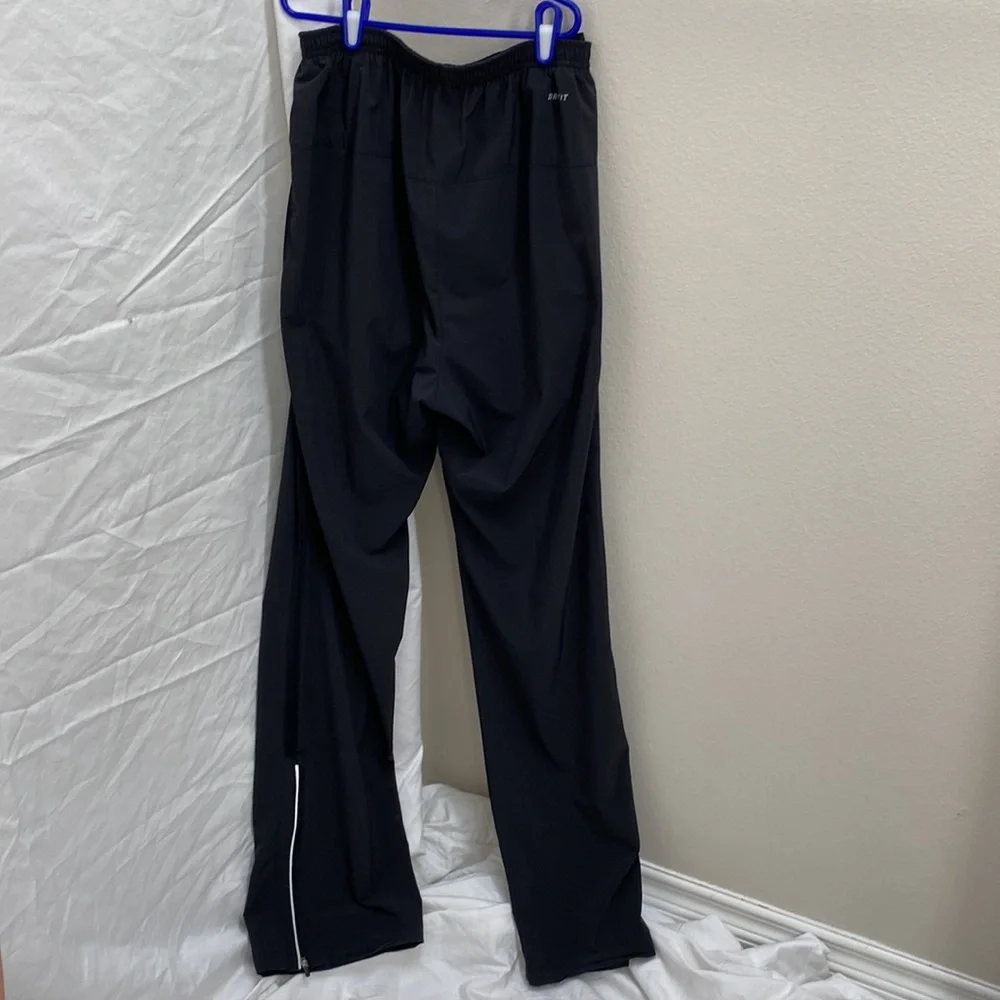 Nike Men’s Dri-Fit black running joggers. Size small.